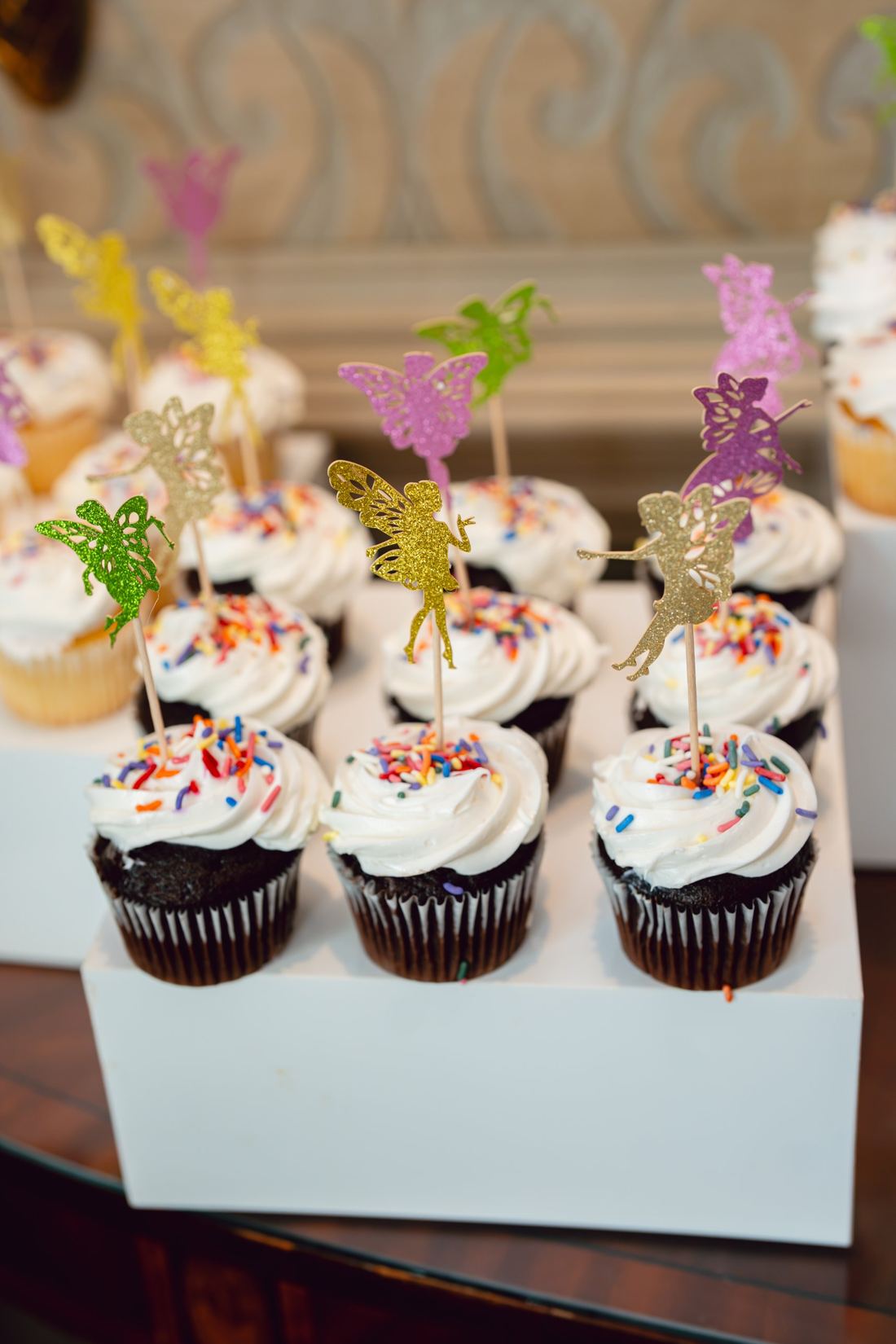 Cupcakes topped with glitter fairy picks