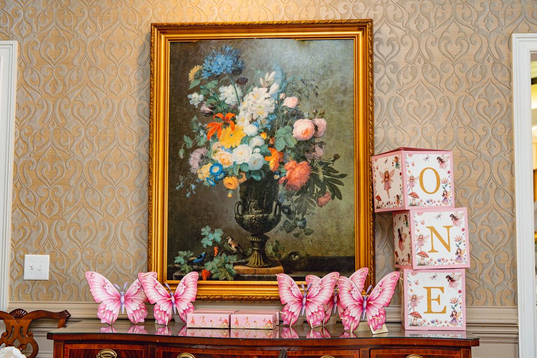 Mantel dressed with butterflies and ONE blocks