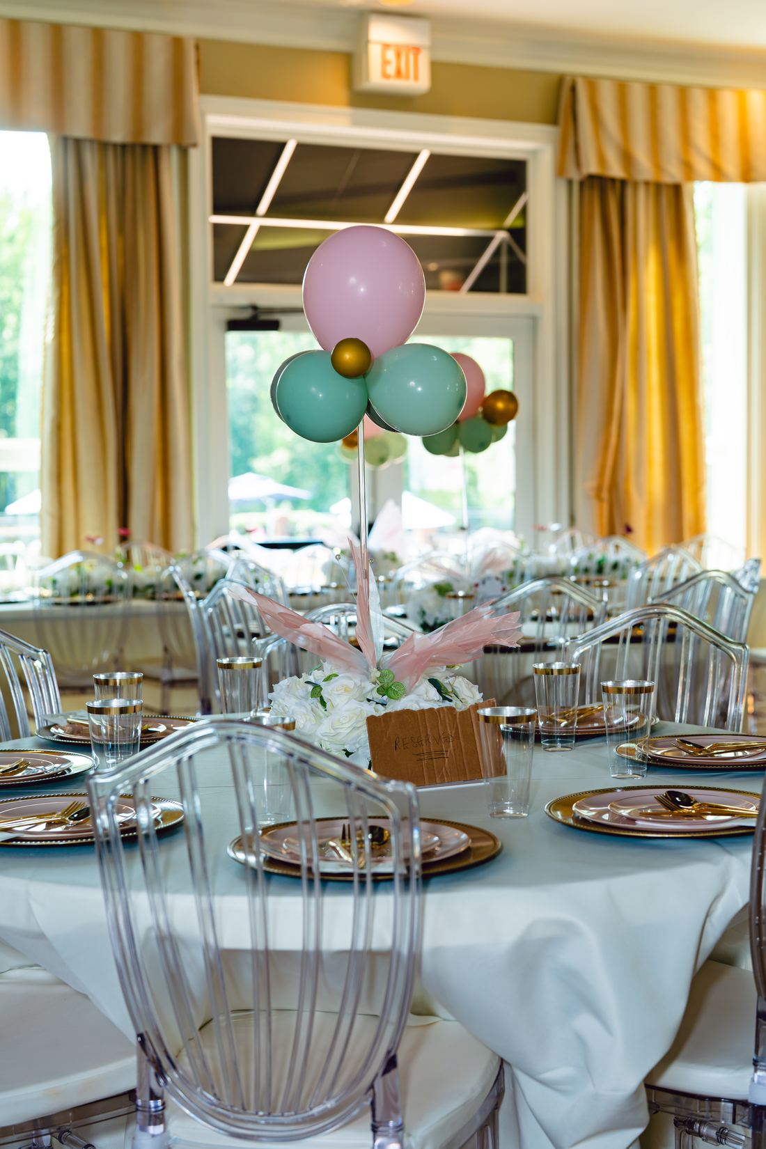 Formal round table setting with reserved card and glassware